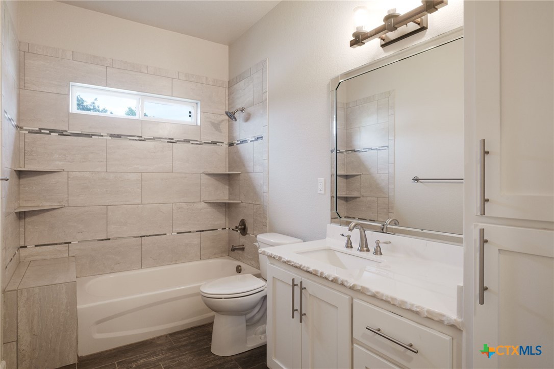 2662 Snow Road Kempner, TX 76539 - Photo 14 of 28 a bathroom with a sink a toilet and shower