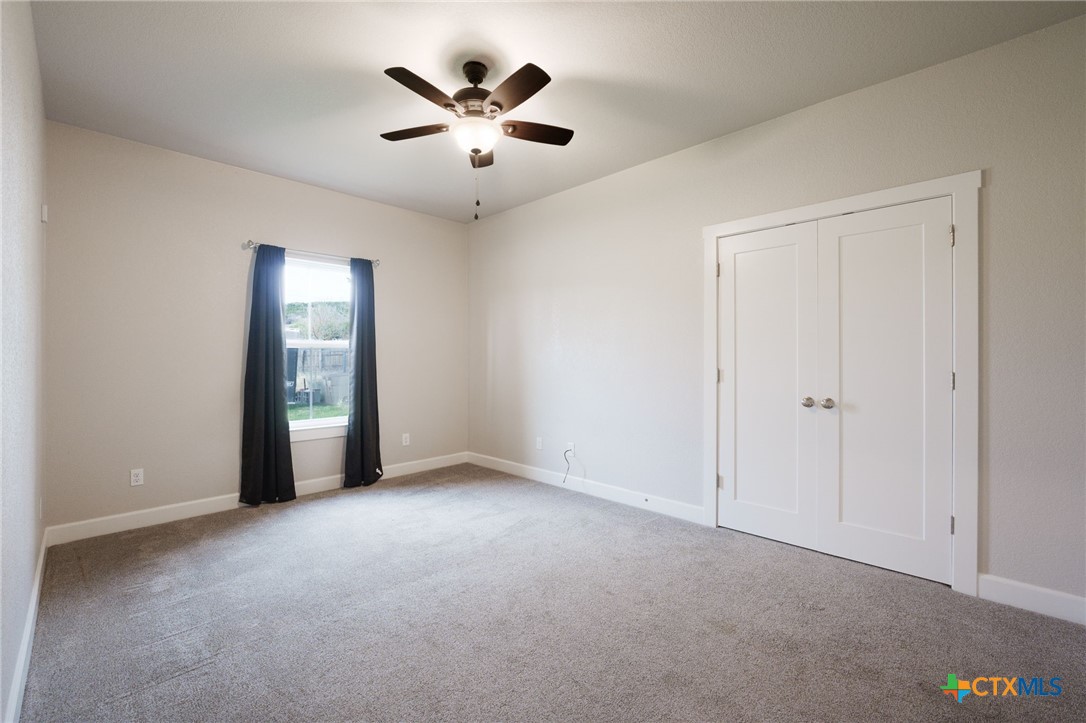 2662 Snow Road Kempner, TX 76539 - Photo 15 of 28 an empty room with chandelier fan