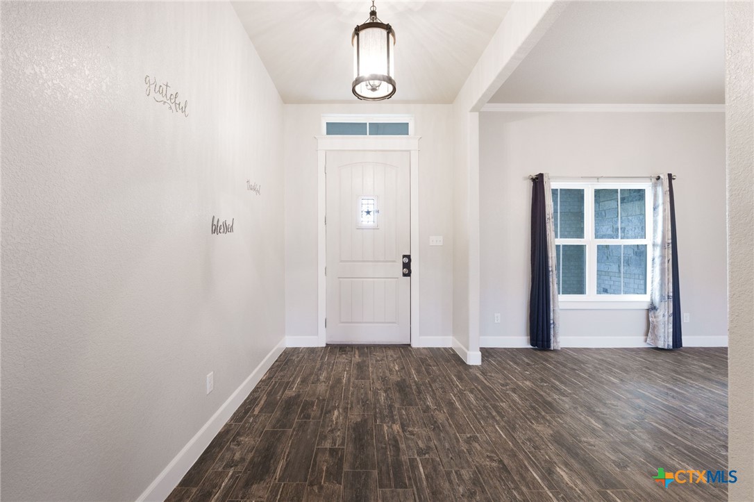 2662 Snow Road Kempner, TX 76539 - Photo 4 of 28 a view of empty room with wooden floor and window
