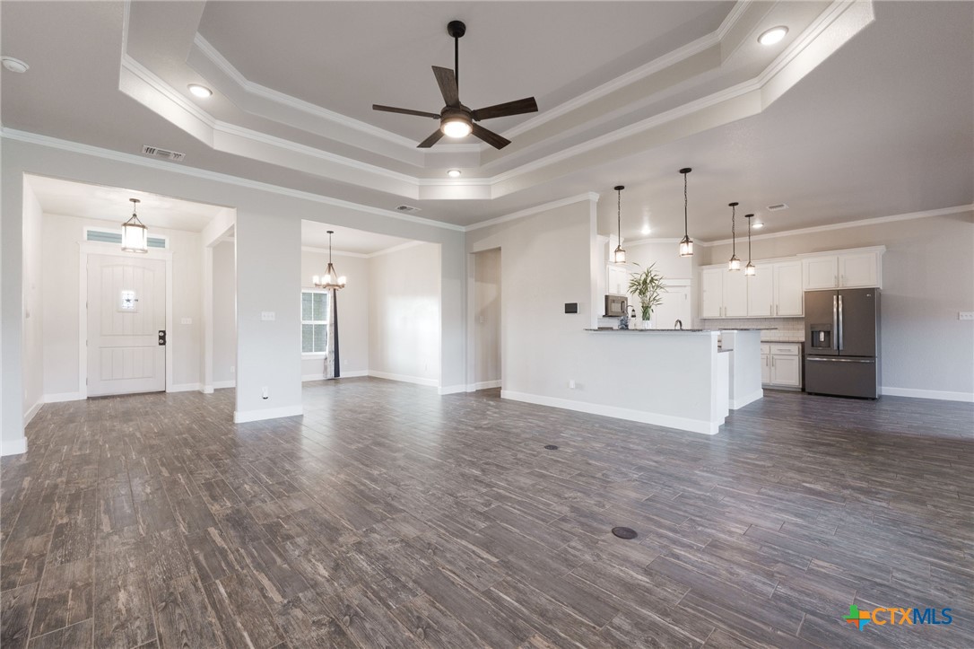 2662 Snow Road Kempner, TX 76539 - Photo 7 of 28 a view of a kitchen with a sink dishwasher a refrigerator and wooden floor