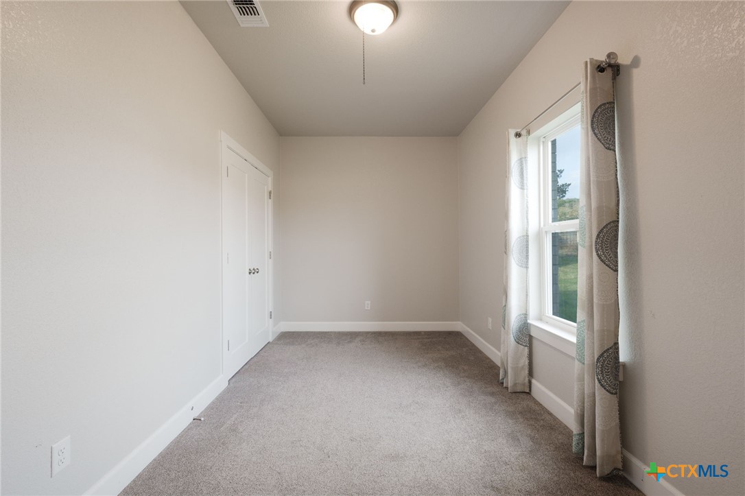 2662 Snow Road Kempner, TX 76539 - Photo 10 of 28 an empty room with a empty space and windows