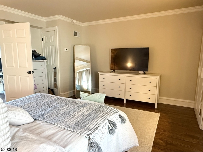 12 Elm Street, Unit B Morristown, NJ 07960 - Photo 12 of 16 a bedroom with a bed and flat screen tv