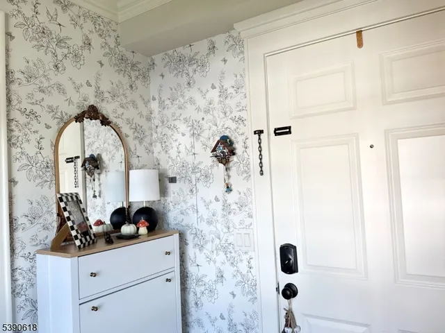 a bathroom with a sink mirror and shower