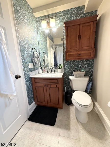 12 Elm Street, Unit B Morristown, NJ 07960 - Photo 14 of 16 a bathroom with a sink and a toilet