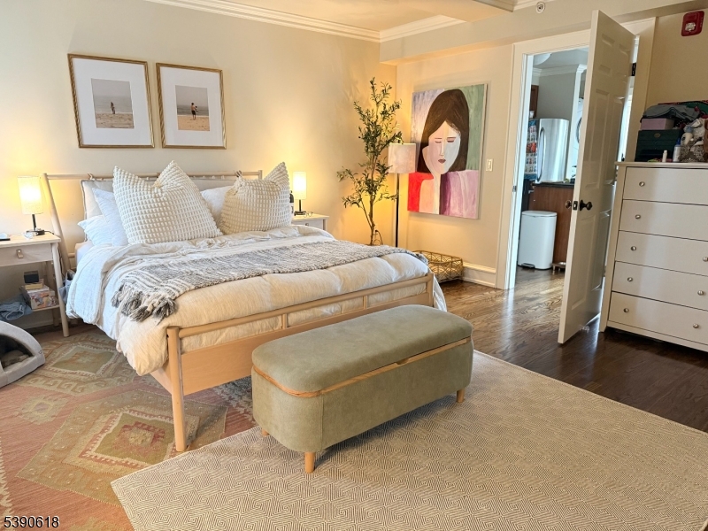 12 Elm Street, Unit B Morristown, NJ 07960 - Photo 4 of 16 a bedroom with a bed and a cabinets