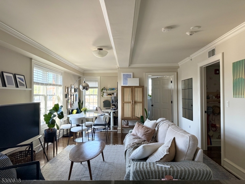 12 Elm Street, Unit B Morristown, NJ 07960 - Photo 7 of 16 a living room with furniture and a flat screen tv