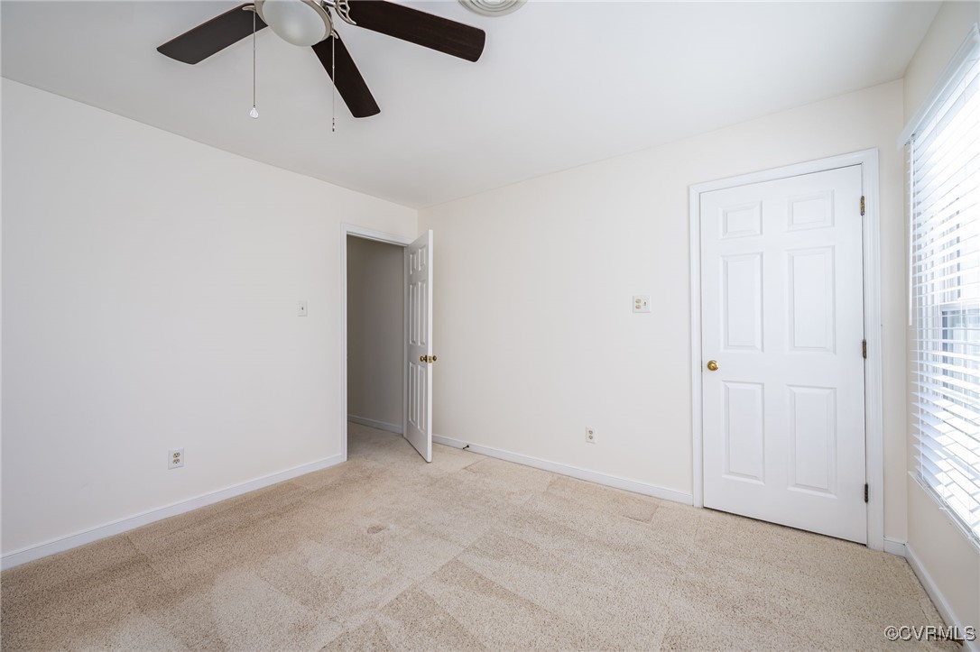 4600 Cedar Cliff Road Chester, VA 23831 - Photo 29 of 37 an empty room with ceiling fan and window