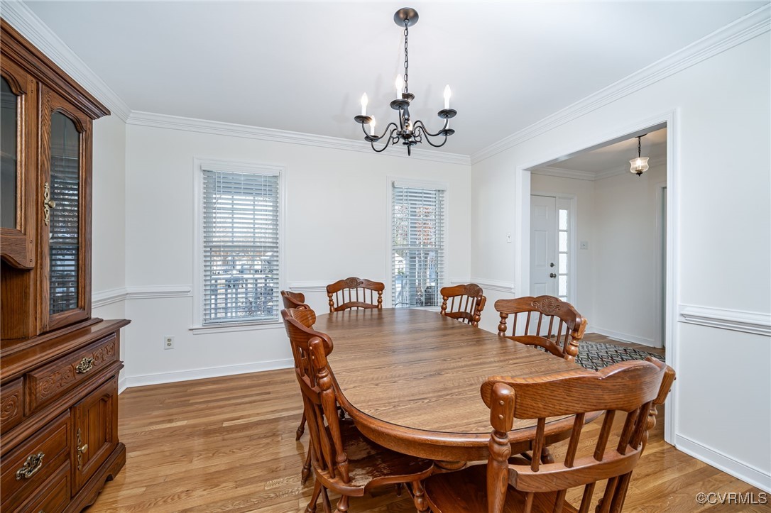 4600 Cedar Cliff Road Chester, VA 23831 - Photo 8 of 37 a view of a dining room with furniture window and wooden floor
