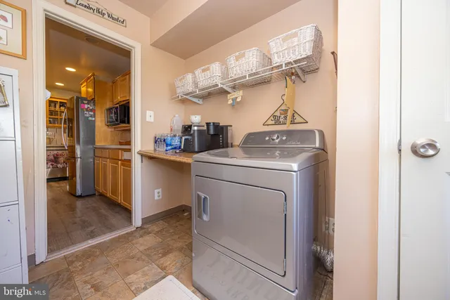 a kitchen view of a stove and a refrigerator