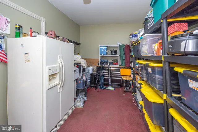 a kitchen with stainless steel appliances granite countertop a refrigerator and a stove