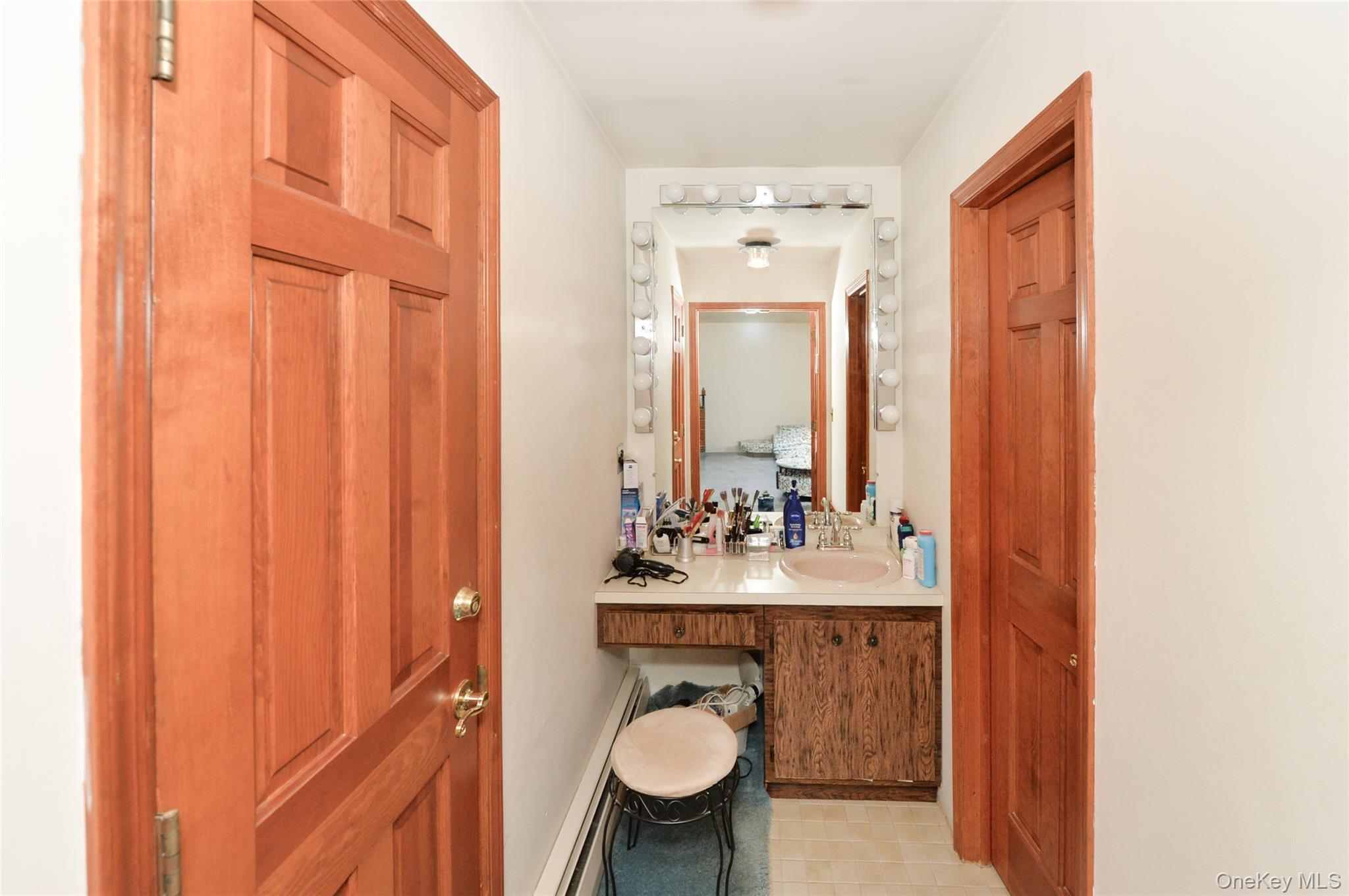 24 Highview Road Monsey, NY 10952 - Photo 27 of 44 a bathroom with a sink a toilet and mirror