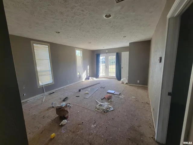 a view of empty room with windows