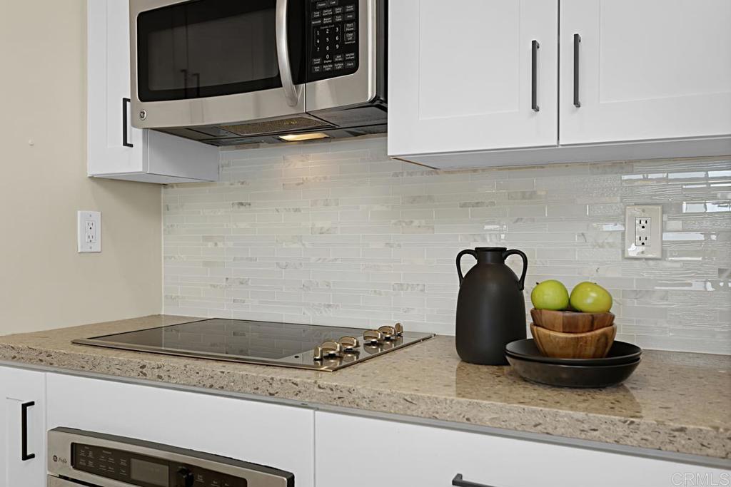 2500 Torrey Pines Road, Unit 503 La Jolla, CA 92037 - Photo 12 of 46 a kitchen with a stove and a microwave