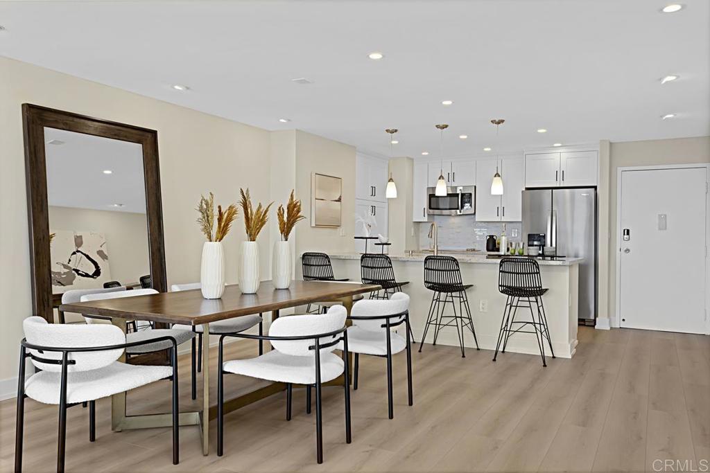 2500 Torrey Pines Road, Unit 503 La Jolla, CA 92037 - Photo 7 of 46 a view of a dining room with furniture and wooden floor