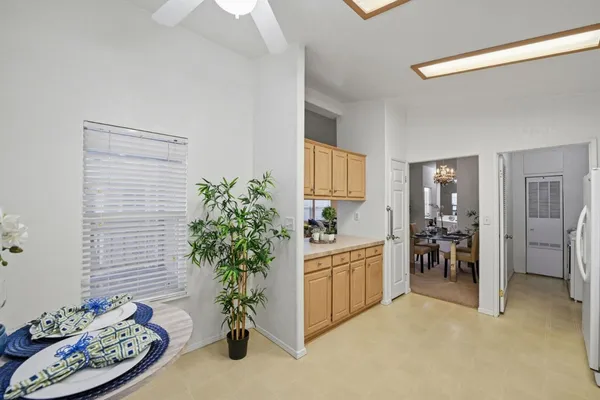 a living room with furniture and flowers