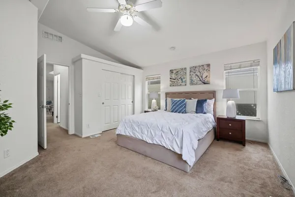 a bed room with a bed and a chandelier
