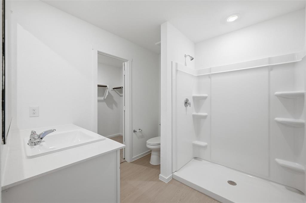 1613 Elliott Road Howe, TX 75459 - Photo 14 of 19 a bathroom with a shower and a toilet