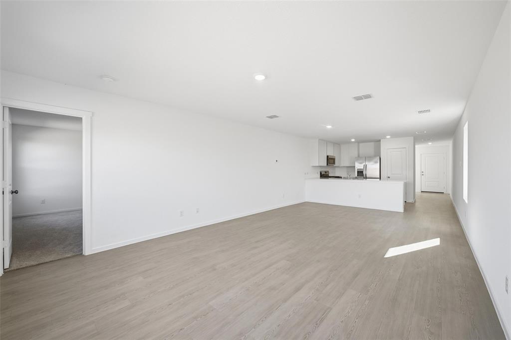 1613 Elliott Road Howe, TX 75459 - Photo 3 of 19 a view of a kitchen with wooden floor and a sink