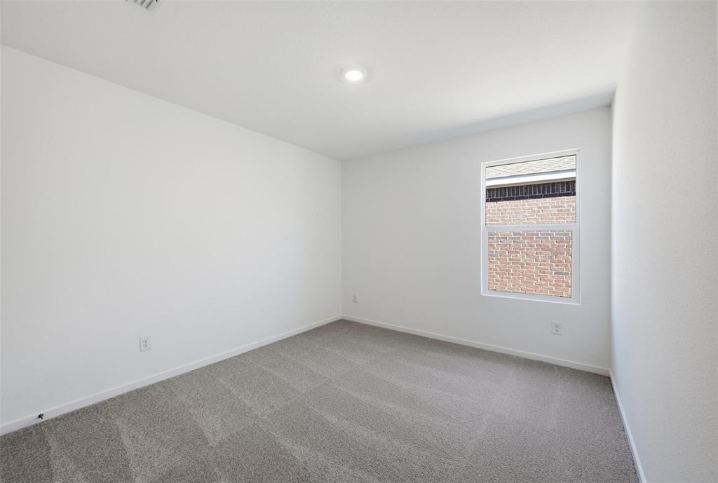 1613 Elliott Road Howe, TX 75459 - Photo 8 of 19 an empty room with a window