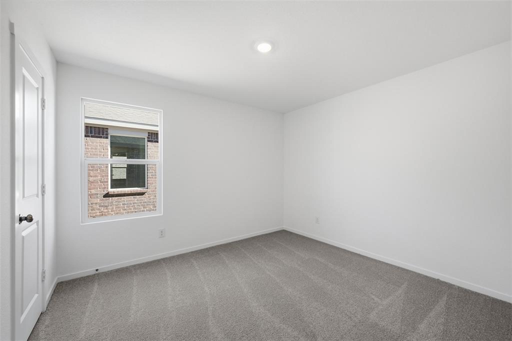 1613 Elliott Road Howe, TX 75459 - Photo 9 of 19 an empty room with a window