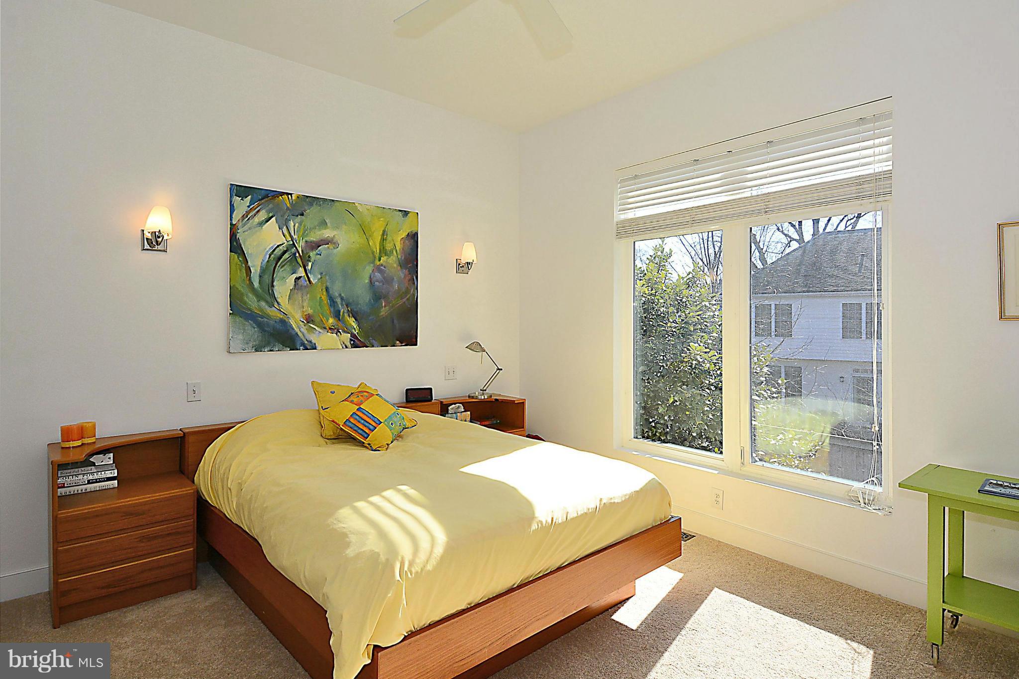 823 Rowen Road Silver Spring, MD 20910 - Photo 15 of 30 a bedroom with a bed and a painting on the wall