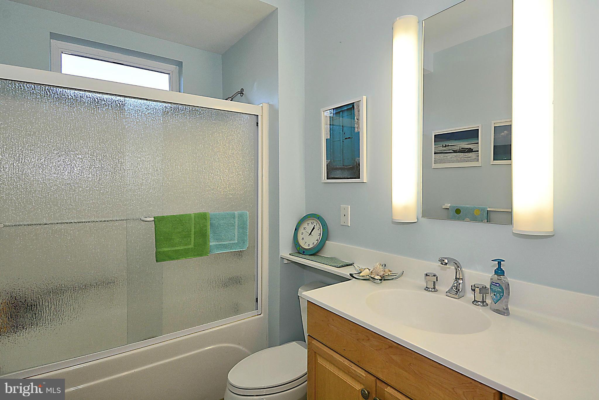 823 Rowen Road Silver Spring, MD 20910 - Photo 21 of 30 a bathroom with a sink toilet and shower