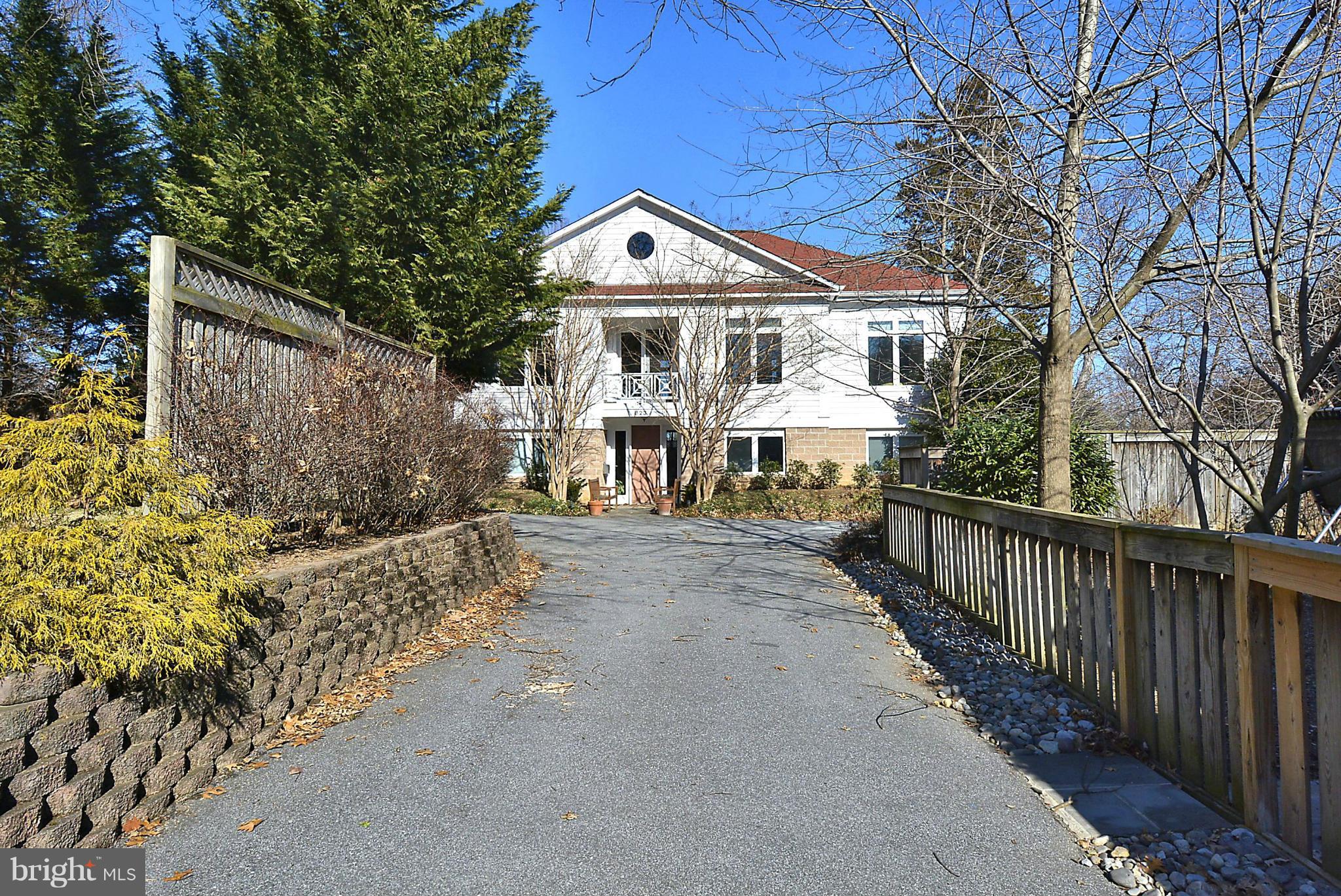 823 Rowen Road Silver Spring, MD 20910 - Photo 28 of 30 a view of a house with large windows and a pathway