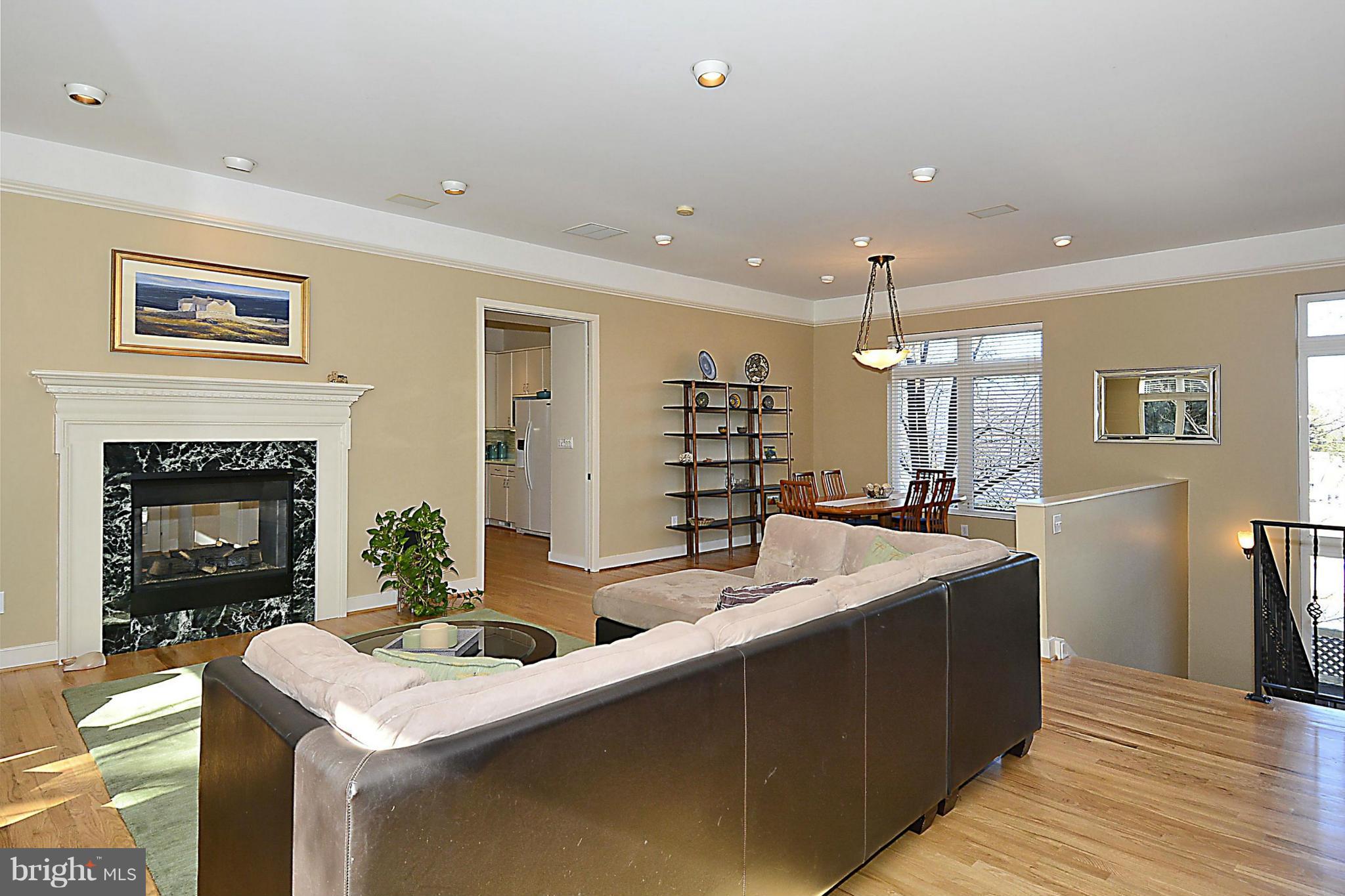 823 Rowen Road Silver Spring, MD 20910 - Photo 7 of 30 a room with pool table and a fireplace