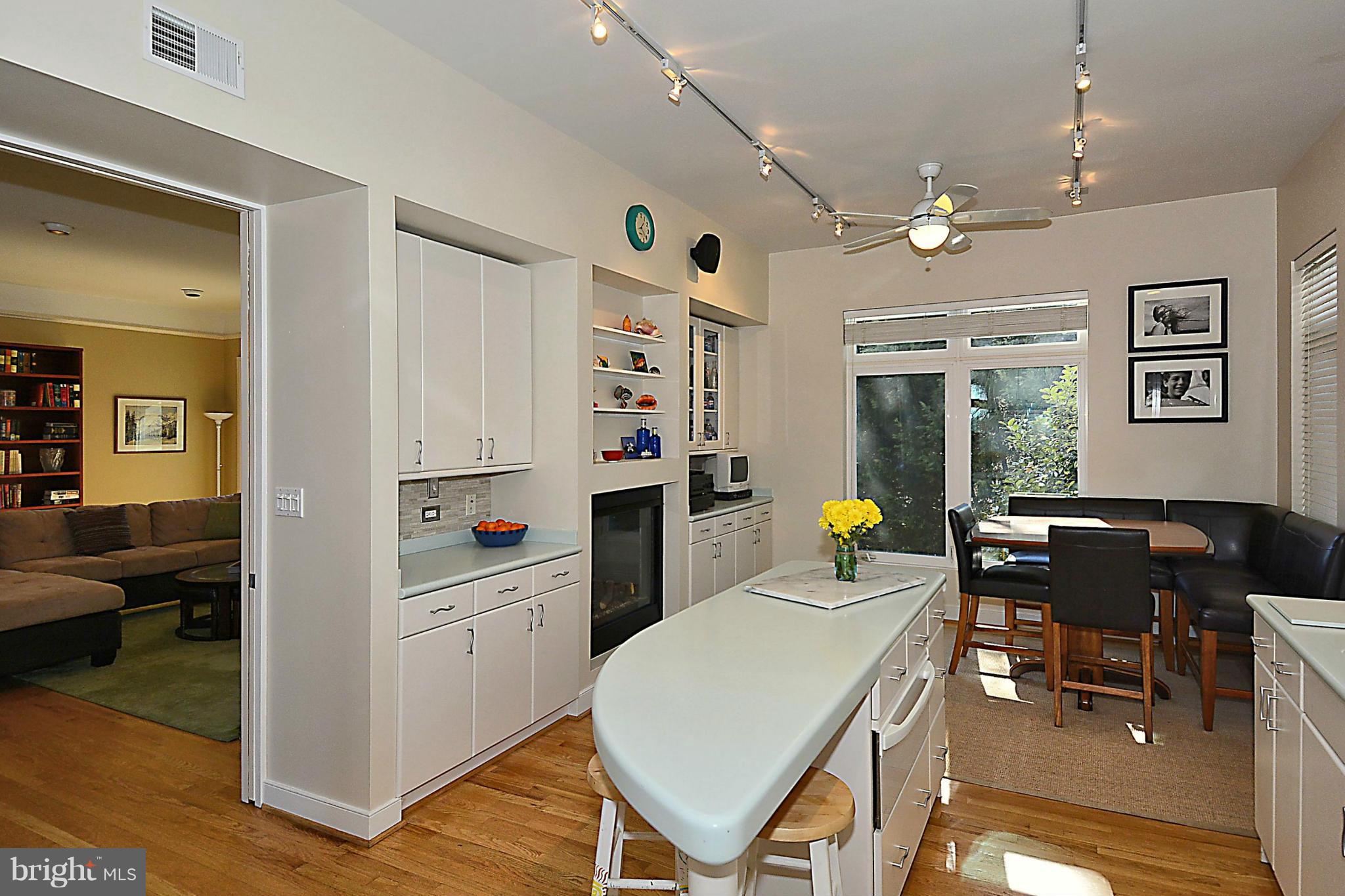 823 Rowen Road Silver Spring, MD 20910 - Photo 9 of 30 a kitchen with a refrigerator and a table