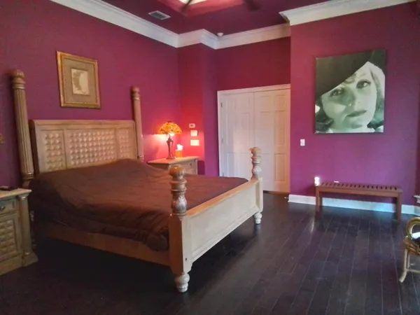 a white toilet sitting next to a white wall