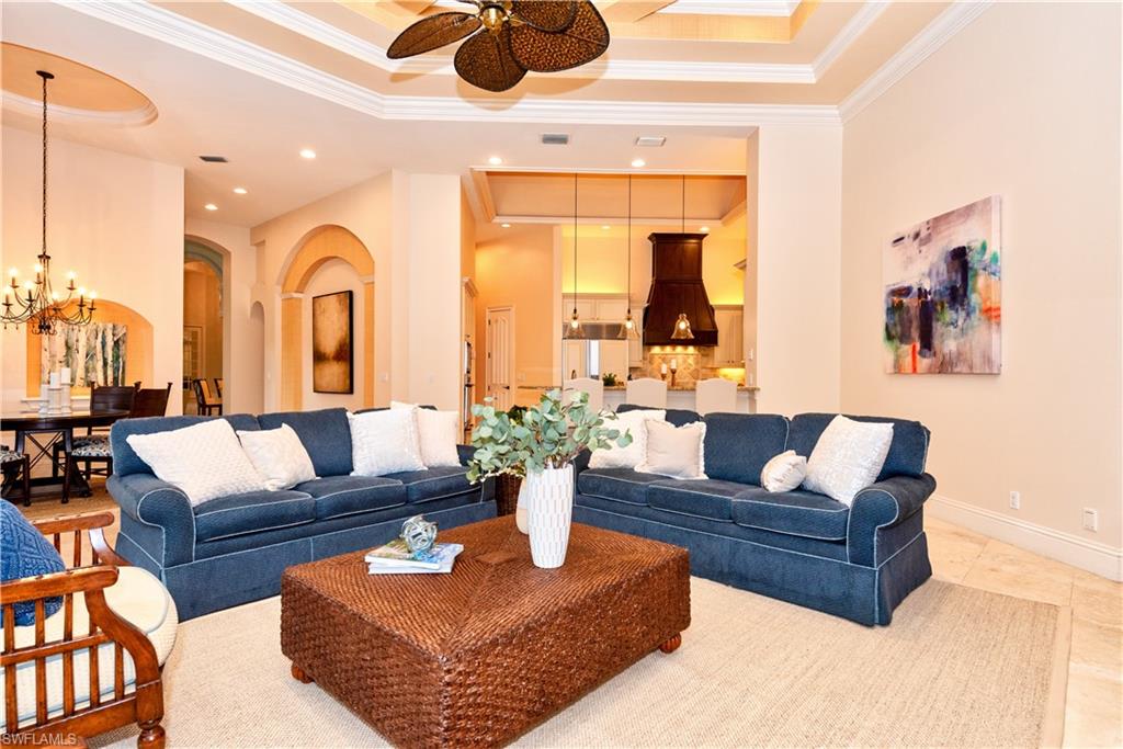 3110 Dahlia Way Naples, FL 34105 - Photo 22 of 35 a living room with furniture and a large window