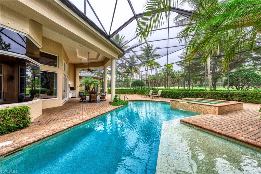3110 Dahlia Way Naples, FL 34105 - Photo 28 of 35 a view of a swimming pool with a patio