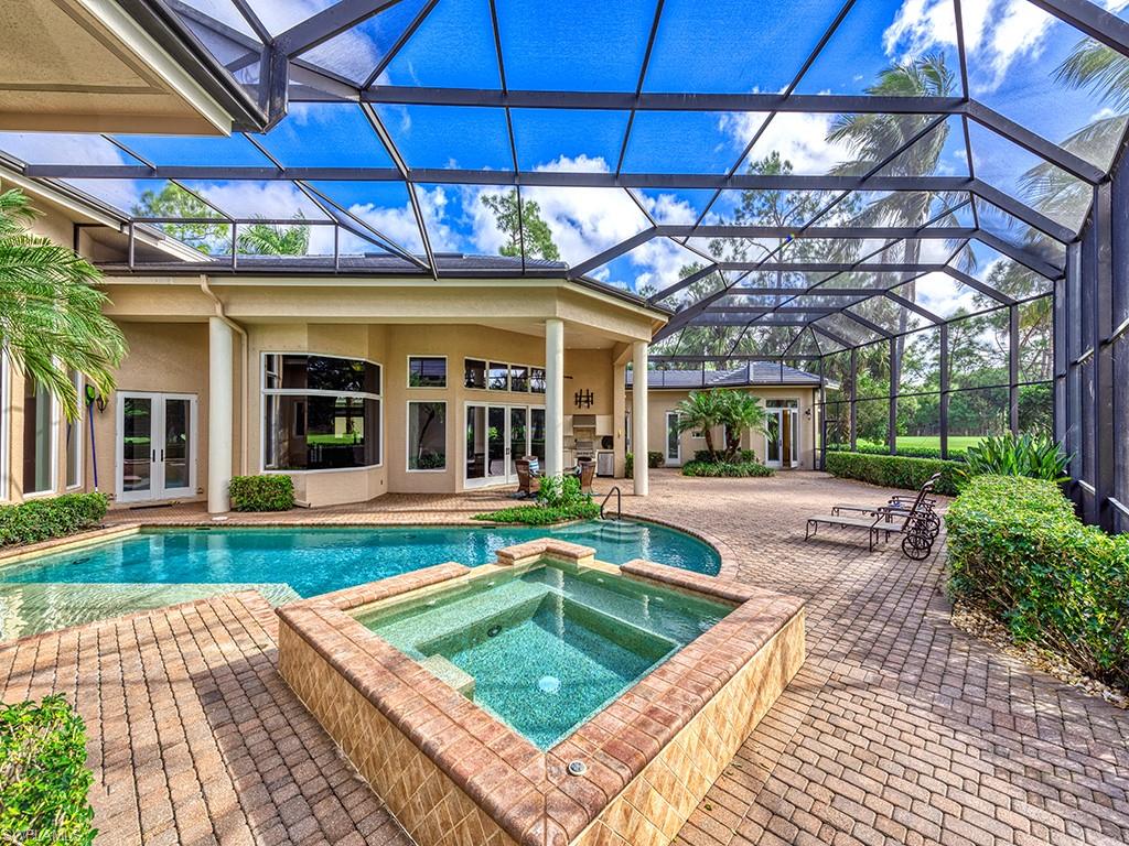 3110 Dahlia Way Naples, FL 34105 - Photo 29 of 35 a view of a house with a swimming pool