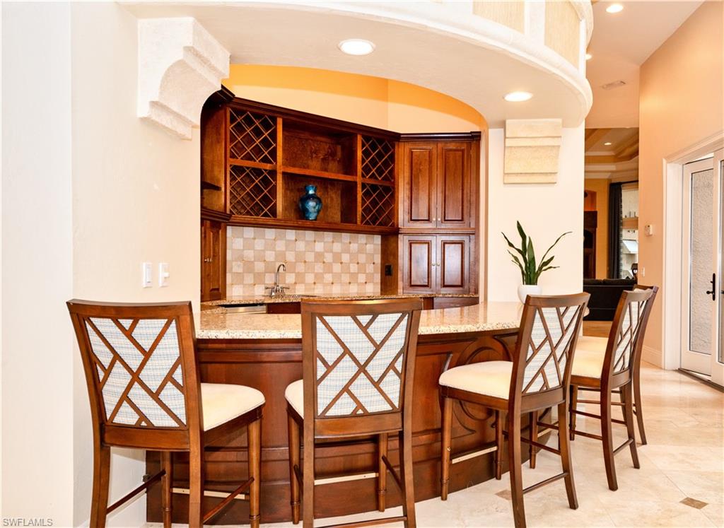 3110 Dahlia Way Naples, FL 34105 - Photo 5 of 35 a view of a chairs and table in the patio