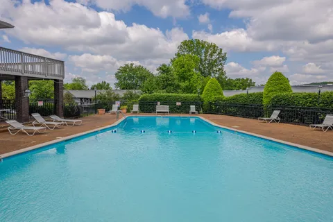 a view of a swimming pool with a patio