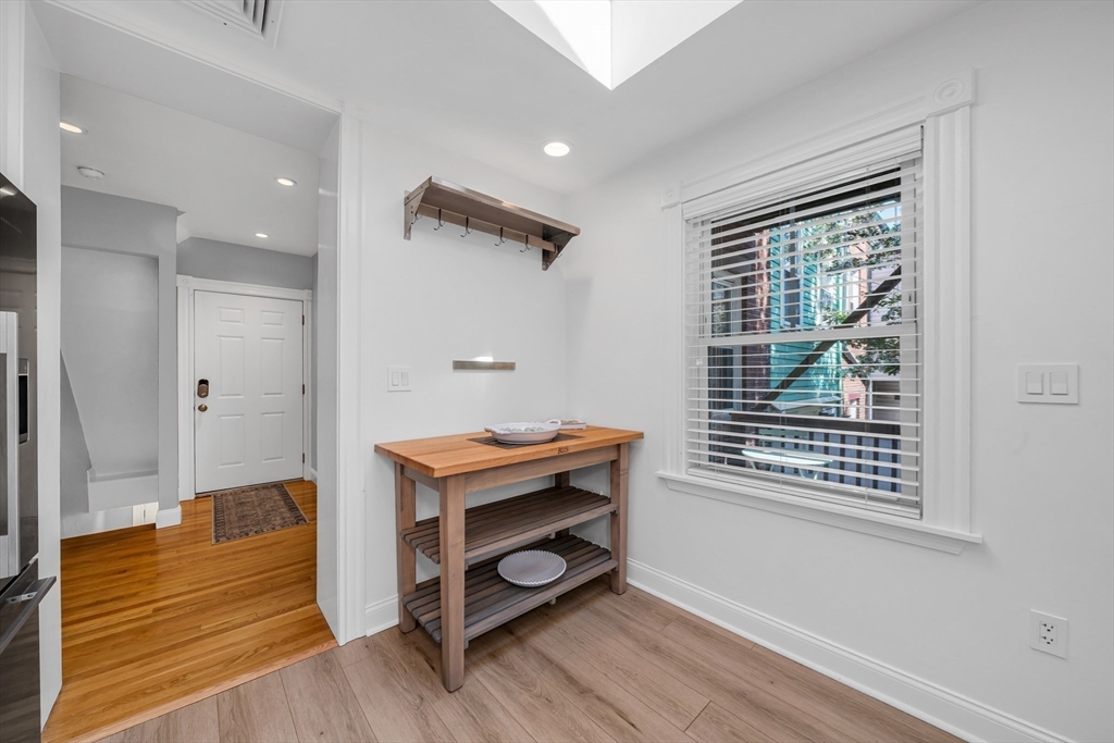 93 Baldwin Street, Unit 1 Boston, MA 02129 - Photo 14 of 30 a room with wooden floor and a window