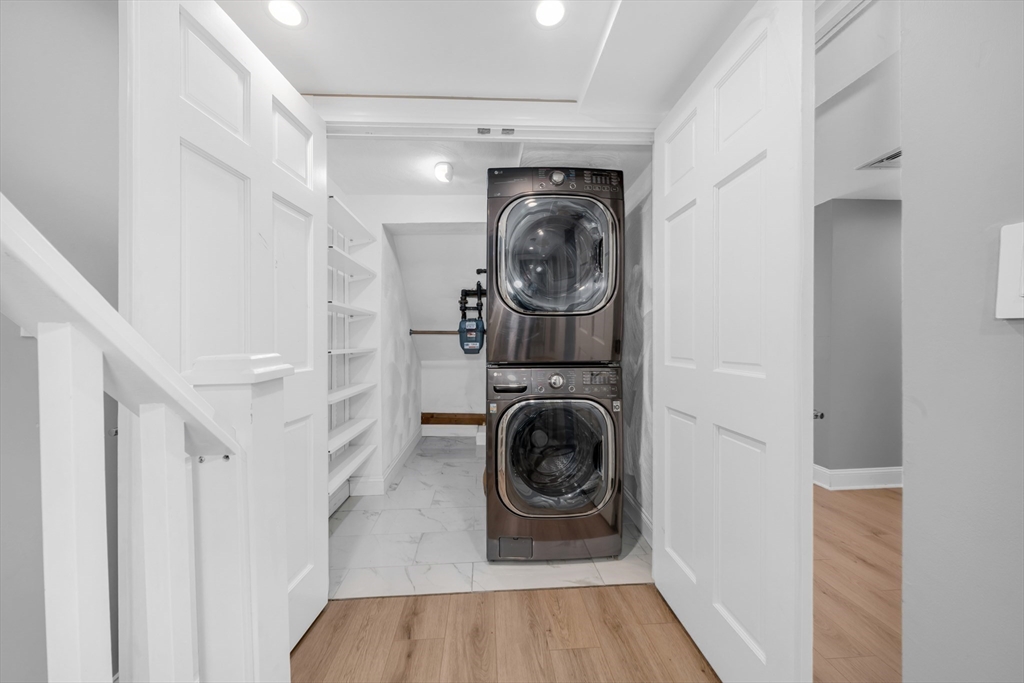 93 Baldwin Street, Unit 1 Boston, MA 02129 - Photo 18 of 30 a utility room with wooden floor washer and dryer