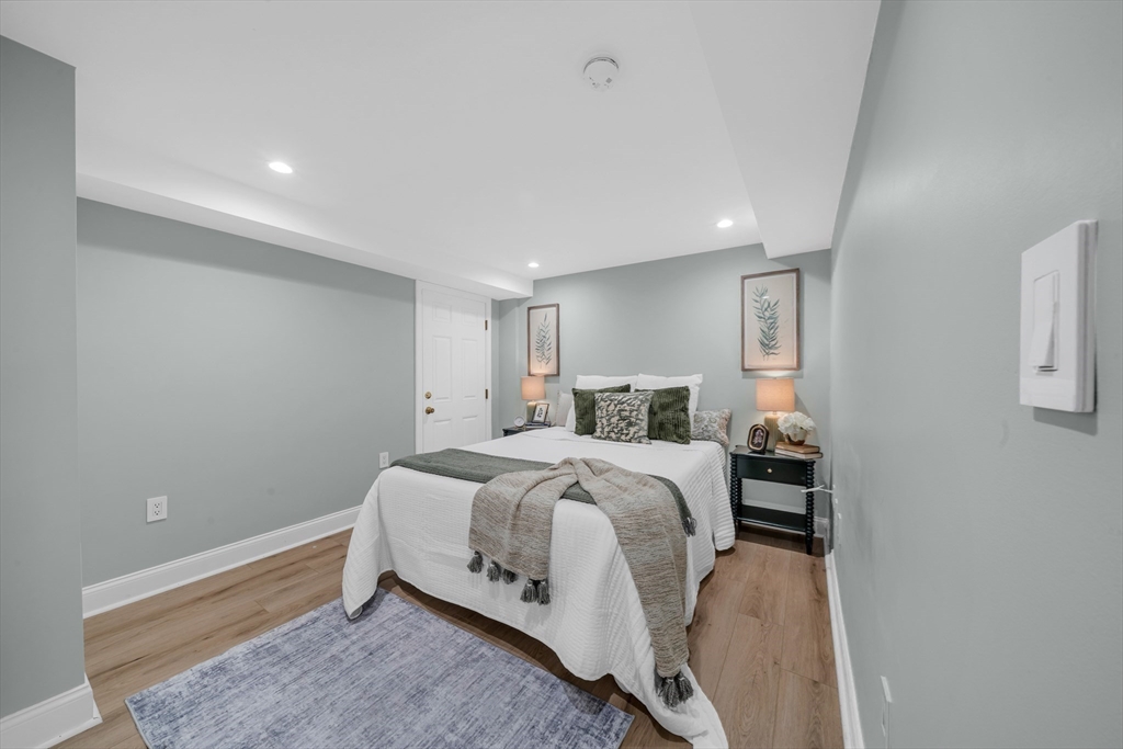 93 Baldwin Street, Unit 1 Boston, MA 02129 - Photo 19 of 30 a bed room with a bed and a window