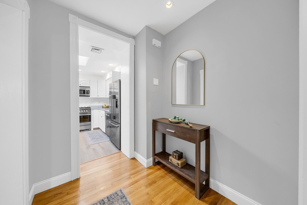 93 Baldwin Street, Unit 1 Boston, MA 02129 - Photo 2 of 30 a room with a mirror and furniture