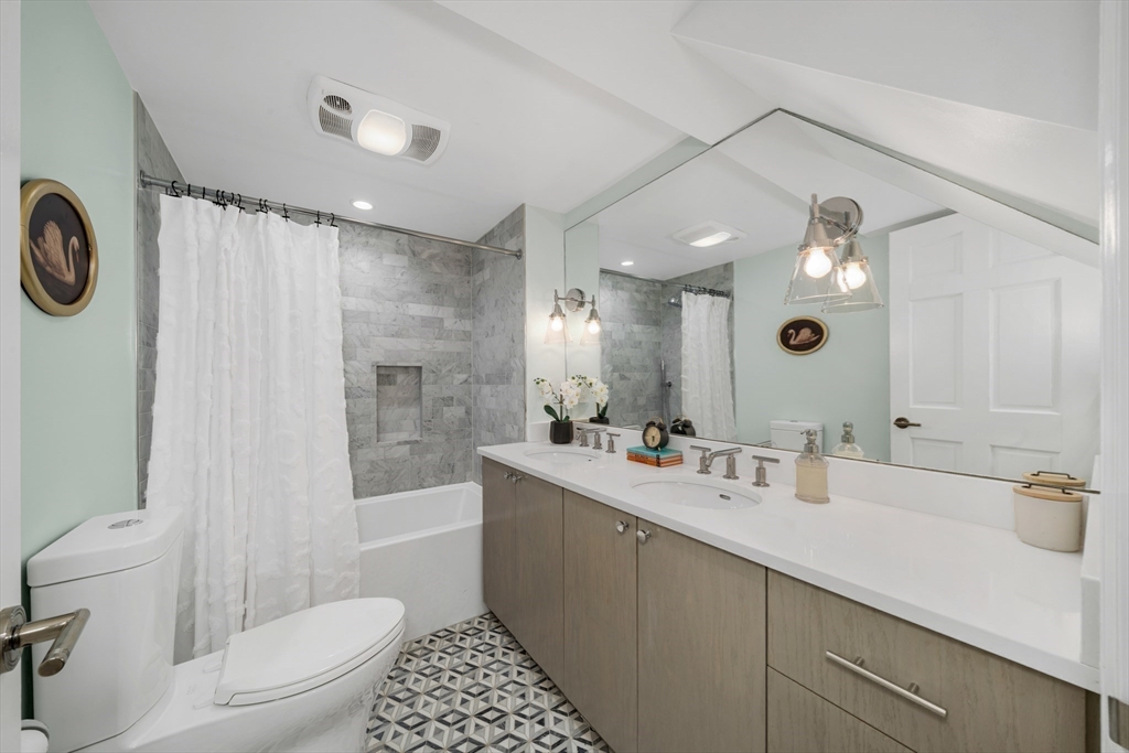 93 Baldwin Street, Unit 1 Boston, MA 02129 - Photo 21 of 30 a bathroom with a sink a toilet and shower