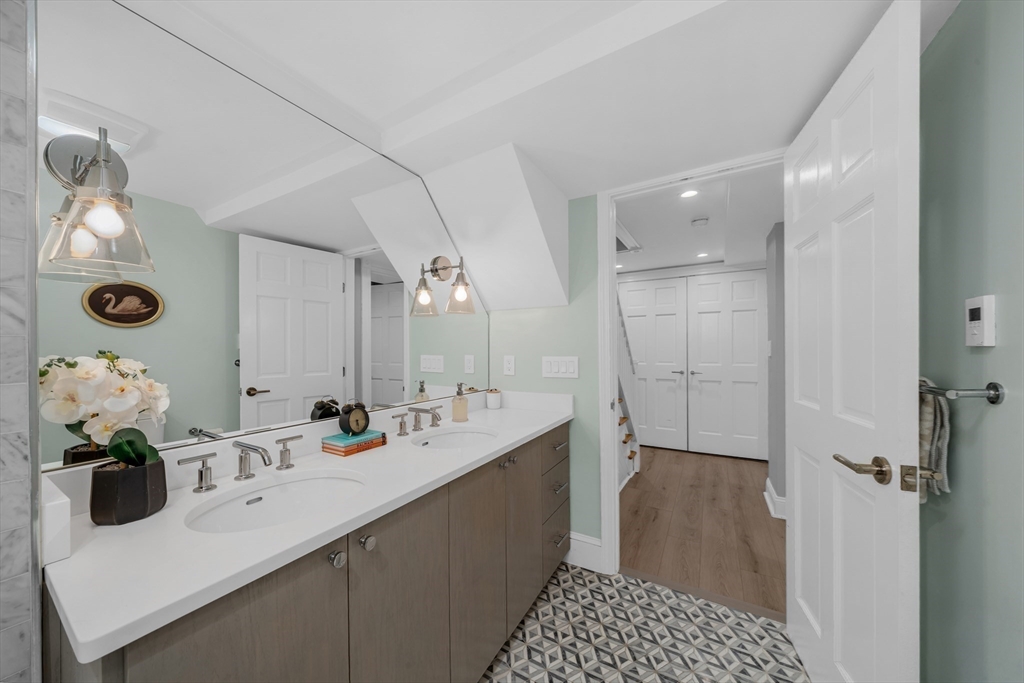 93 Baldwin Street, Unit 1 Boston, MA 02129 - Photo 22 of 30 a bathroom with a sink and a mirror