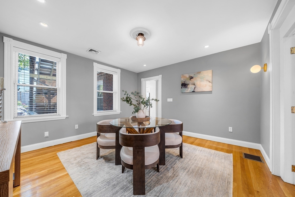93 Baldwin Street, Unit 1 Boston, MA 02129 - Photo 4 of 30 a dining room with furniture and wooden floor