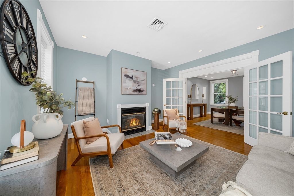 93 Baldwin Street, Unit 1 Boston, MA 02129 - Photo 7 of 30 a living room with furniture and a fireplace
