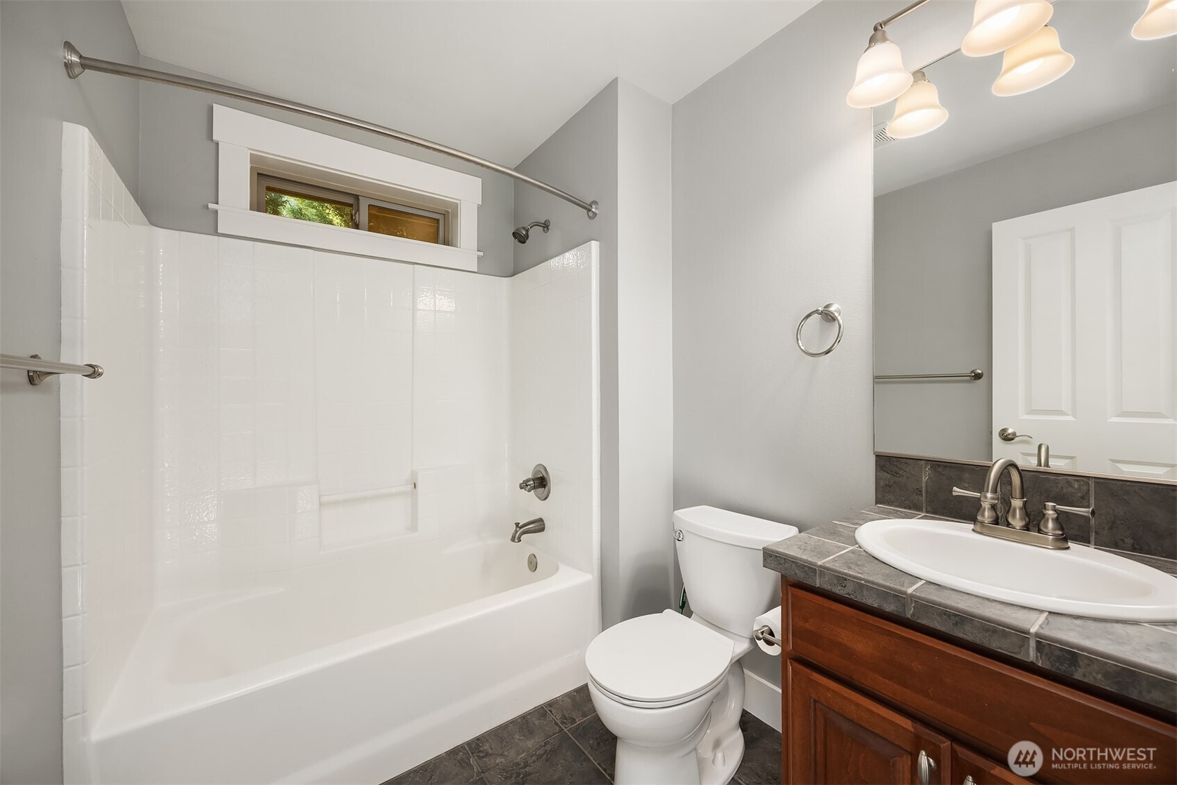 2989 Northeast Davis Loop Issaquah, WA 98029 - Photo 30 of 40 a bathroom with a granite countertop sink toilet and shower