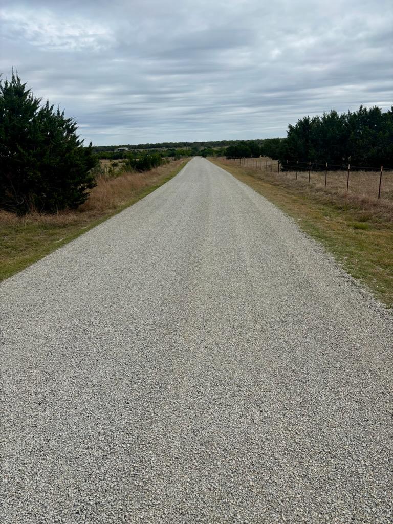 180 Nordic Ridge Road Bertram, TX 78605 - Photo 3 of 12 View of asphalt road with a view of rural / pastoral area