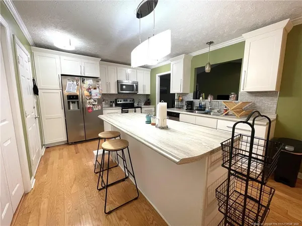 a view of a dining room kitchen and a sink