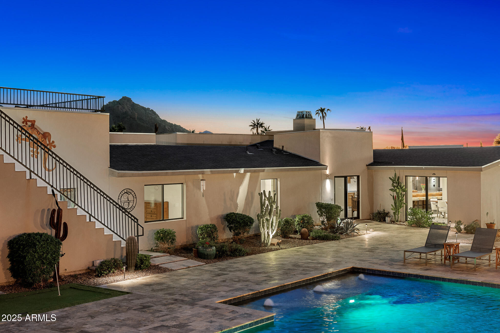 5826 East Indian Bend Road Paradise Valley, AZ 85253 - Photo 49 of 58 a view of a house with swimming pool and sitting area