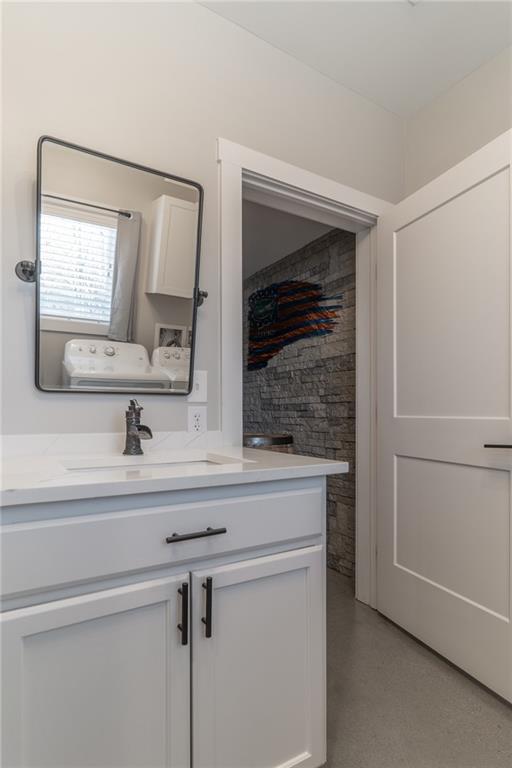 2250 Sperin Road Ball Ground, GA 30107 - Photo 35 of 56 a bathroom with a sink and a mirror
