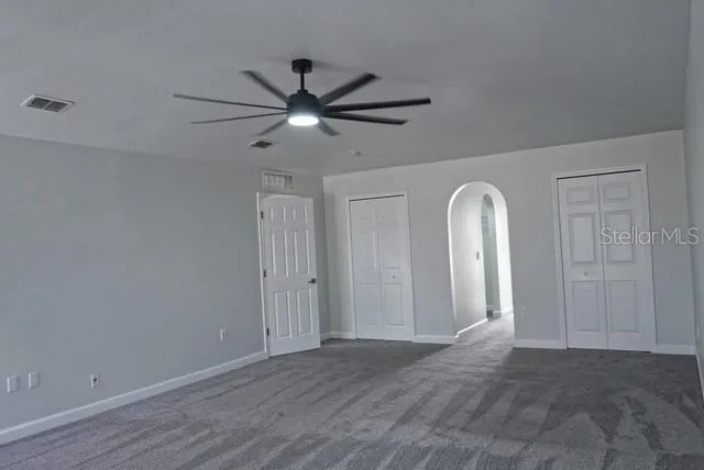 a view of a livingroom from a hallway