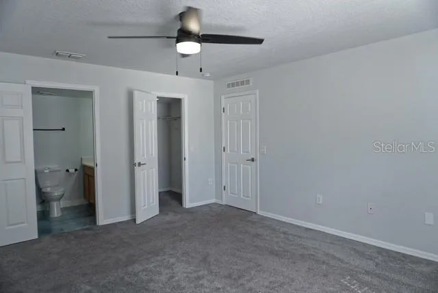 a view of a kitchen with a sink and cabinets